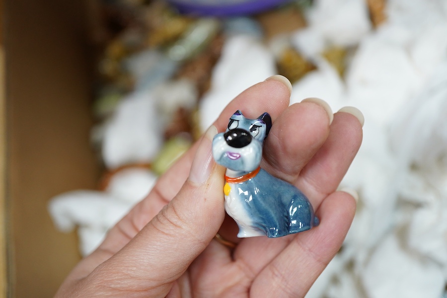 A large collection of Wade Whimsies including Disney Characters and a collection of blown glass animal figures